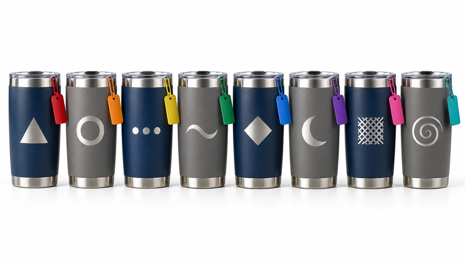 Row of matte stainless steel tumblers, each engraved with a different abstract mark and paired with a matching colored tag, showing one unique design per recipient