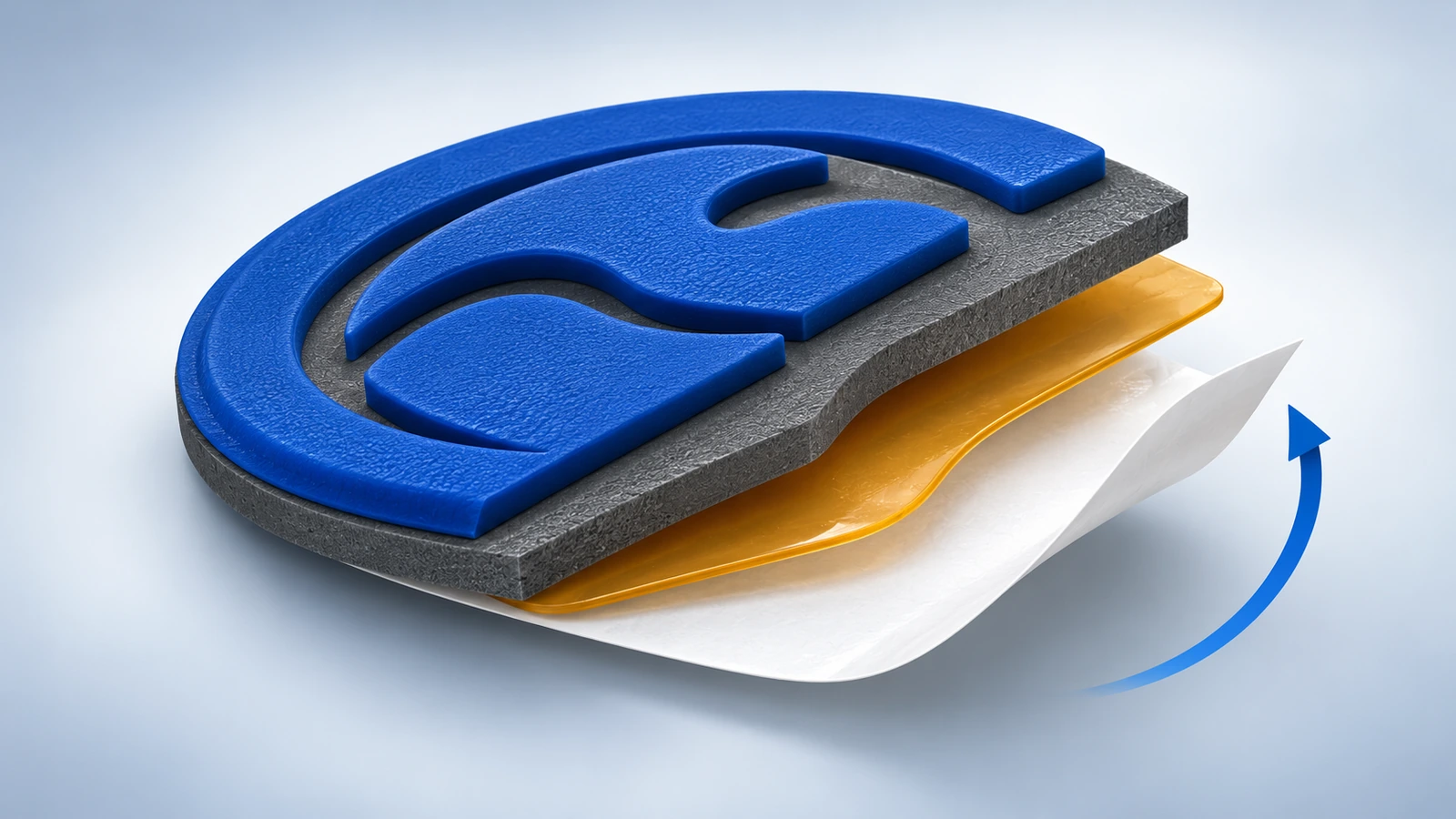 Cross-section of a soft PVC rubber patch showing the raised logo layer, the base, the adhesive layer and the release liner being peeled away