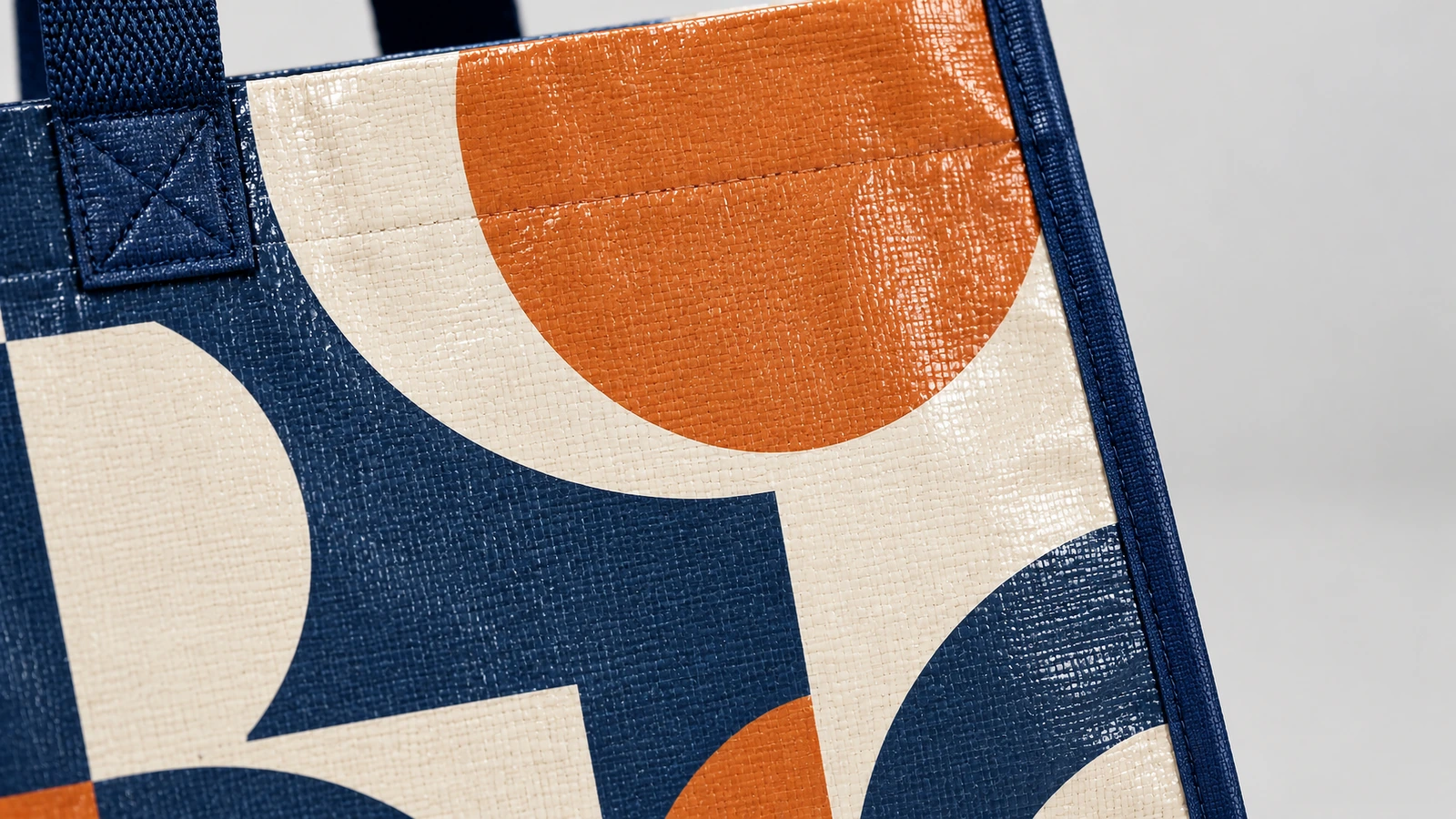 Surface finish and closure options Gloss and matte BOPP laminated swatches with webbing handles, zipper and hook-and-loop closures