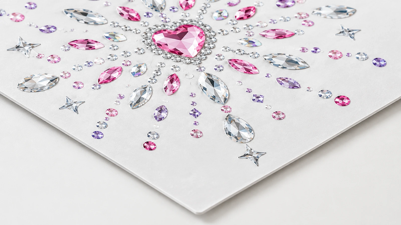 Rhinestone sticker surface and backing options Individually cut versus connected rhinestone sticker backing on release liner with paper, plastic and nail surfaces